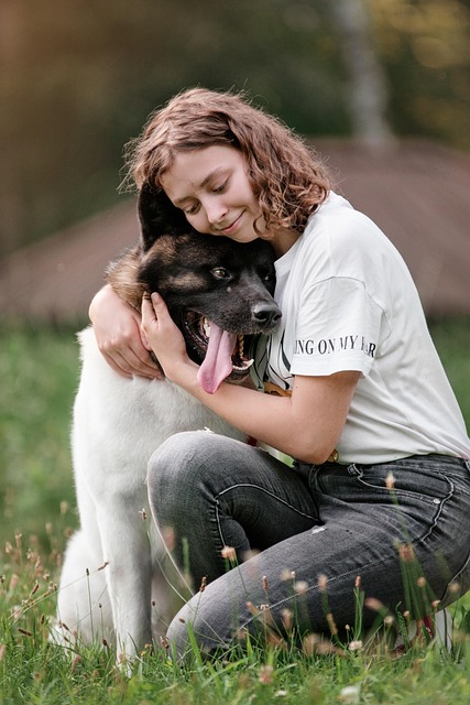 Canadian pet owner journaling pet routine with cat and dog indoors